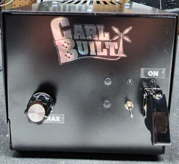 A black box with the words " carl built " on it.