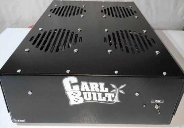 A black metal box with the words " carl built ".