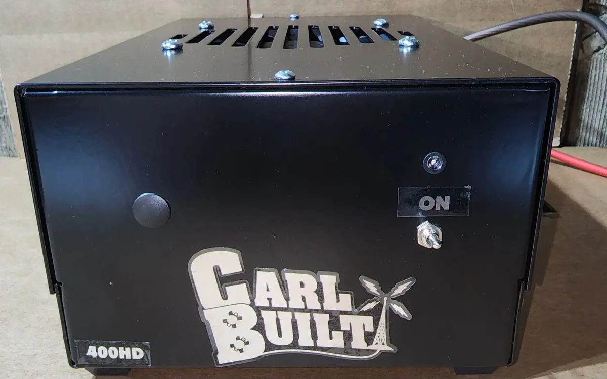 A black box with the words " carl & built " on it.