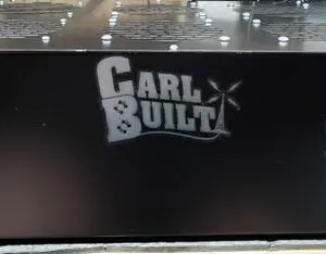 A black box with the words " carl built ".