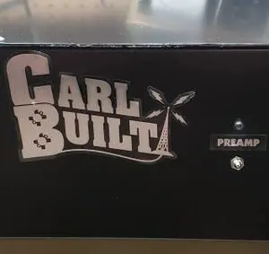 A black box with the words " carl & built " on it.