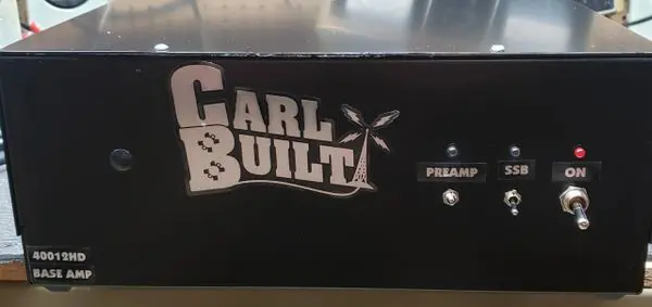 A black box with the words " carl & built " on it.